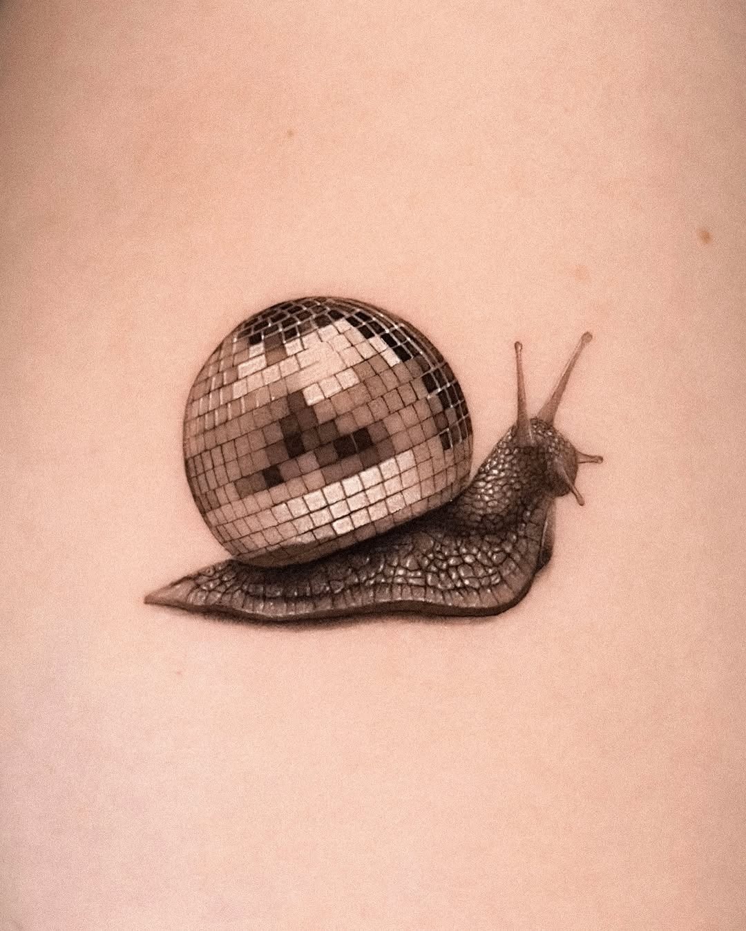 Whimsical snail with a disco ball shell Tattoo Design