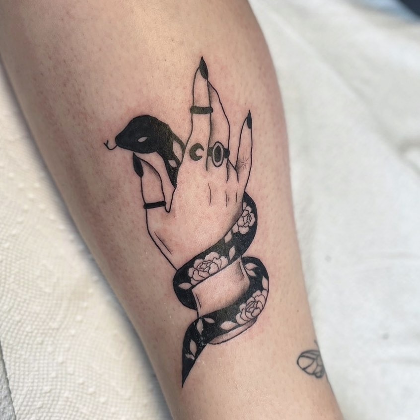 Creative snake tattoo entwined around a hand Tattoo Design