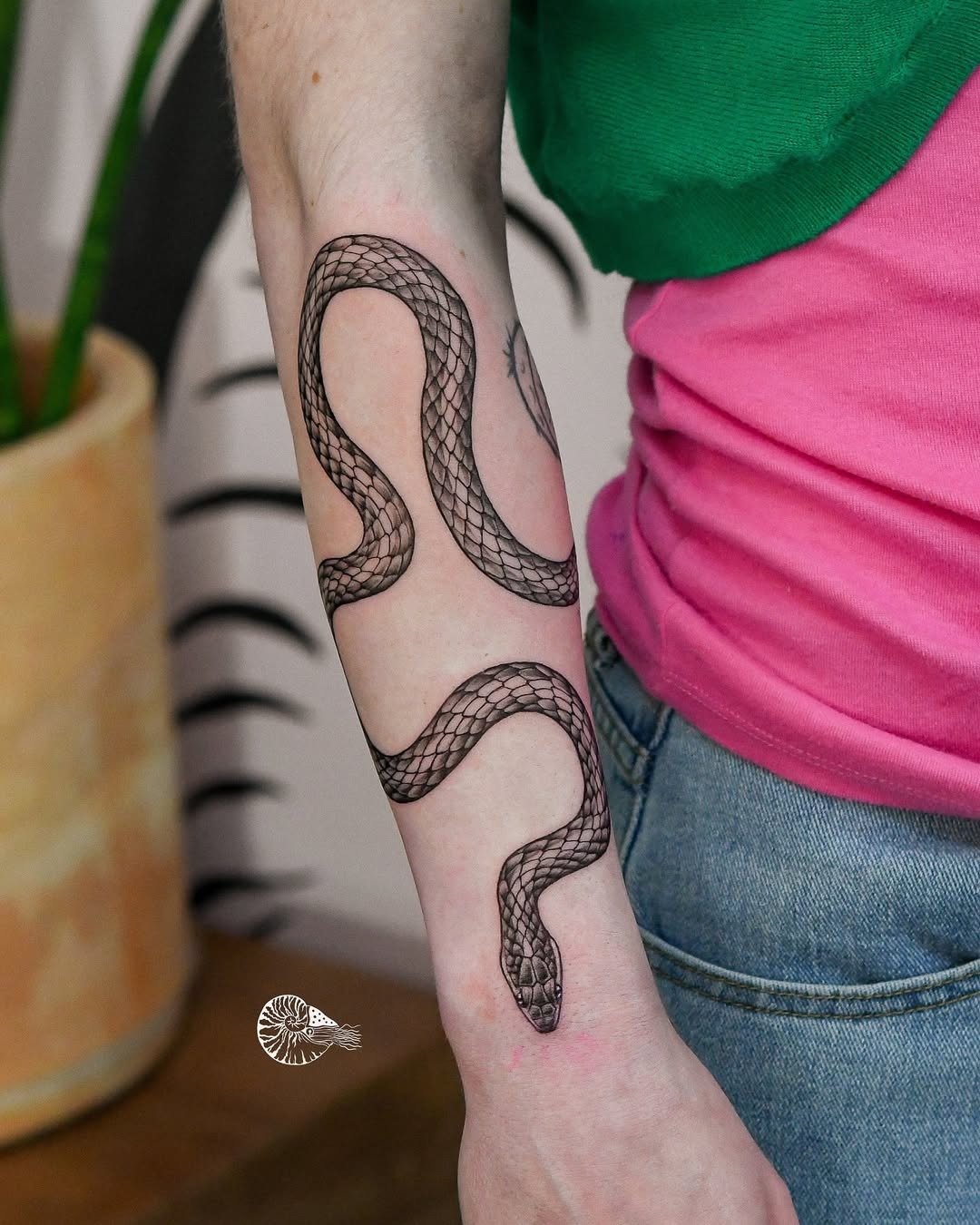 Elegant snake tattoo on a female arm Tattoo Design