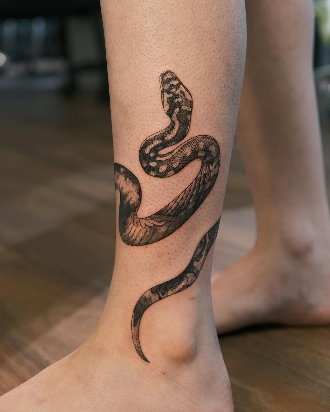Elegant snake tattoo showcasing intricate detailing Tattoo Design