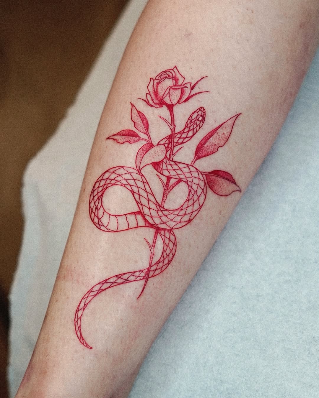 Intricate red snake and rose tattoo art Tattoo Design