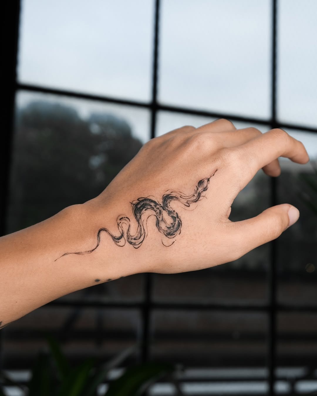 Intricate Snake Tattoo on Hand for Unique Style Tattoo Design