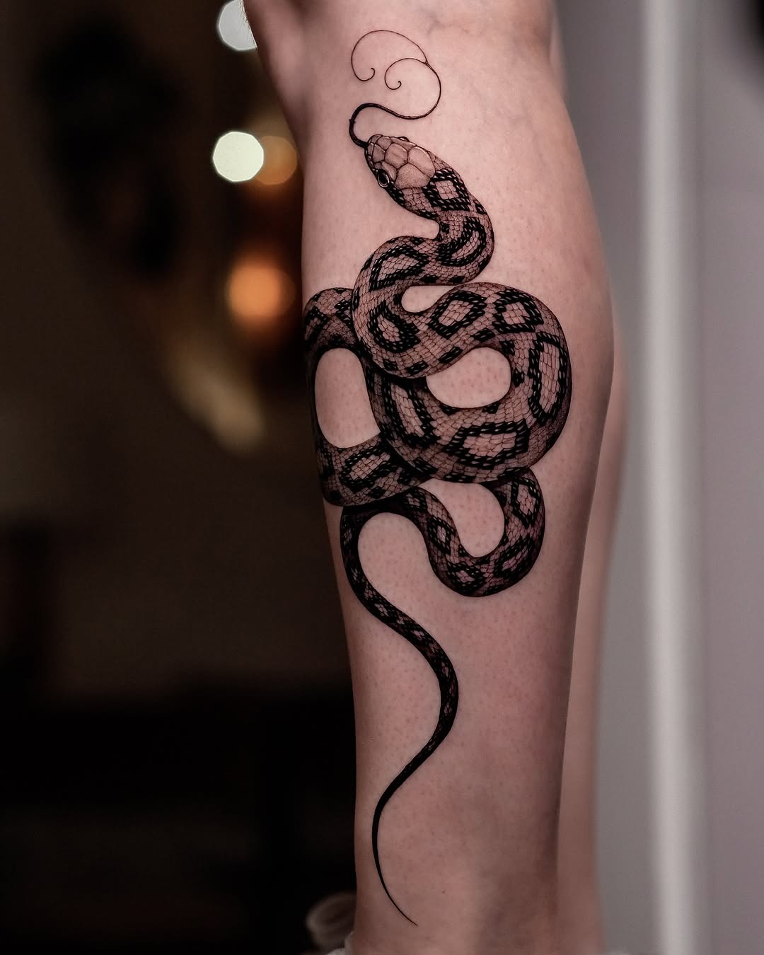 Intricate snake tattoo with ornamental flair Tattoo Design