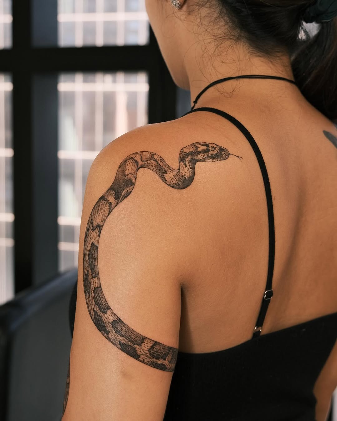 Realistic snake tattoo on upper arm Tattoo Design