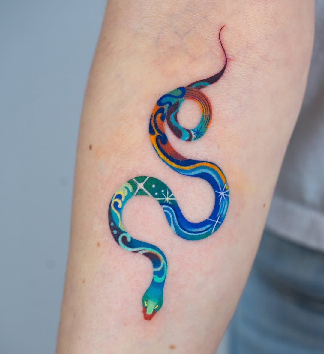 Vibrant snake tattoo with artistic details Tattoo Design
