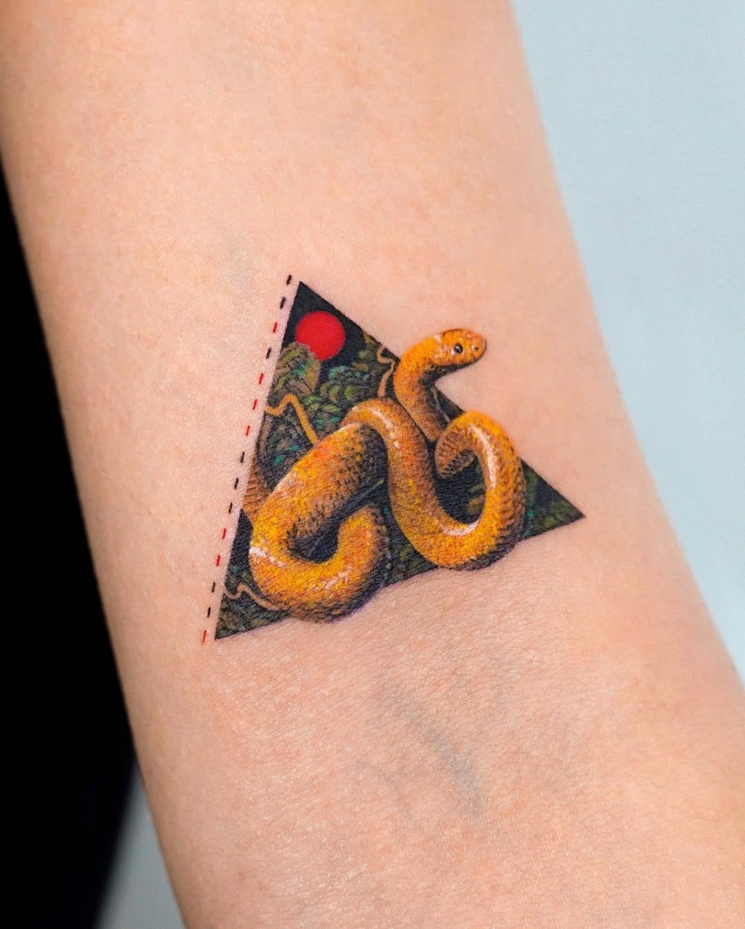 Vivid snake tattoo within triangular art Tattoo Design