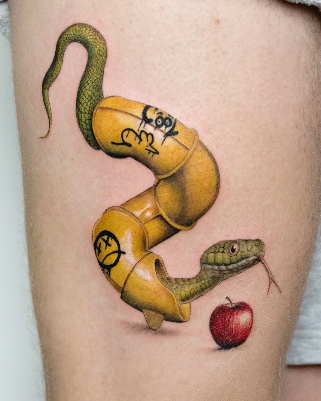 Whimsical snake tattoo with playful elements Tattoo Design
