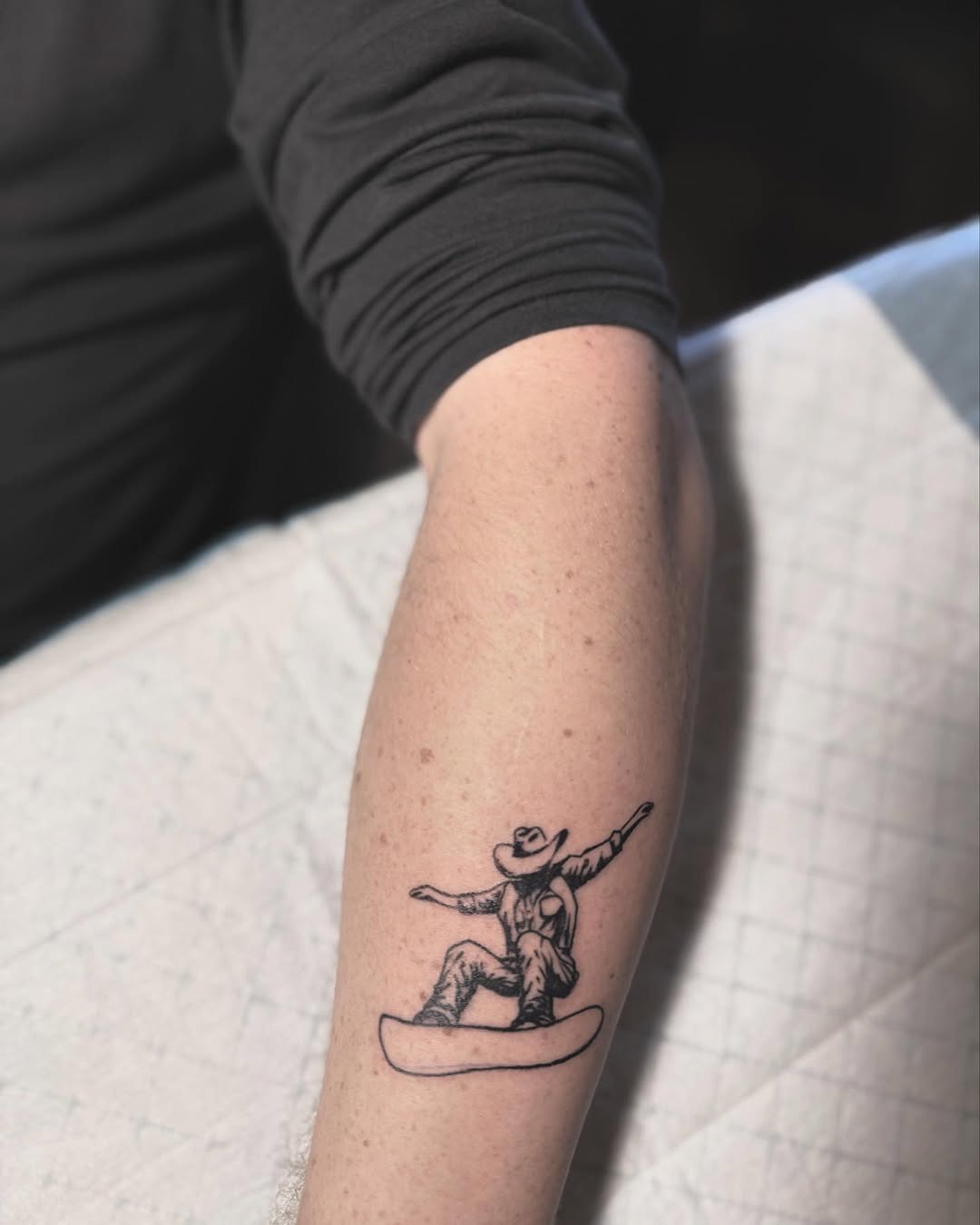 Cowboy-themed snowboard tattoo for adventurous spirits Tattoo Design