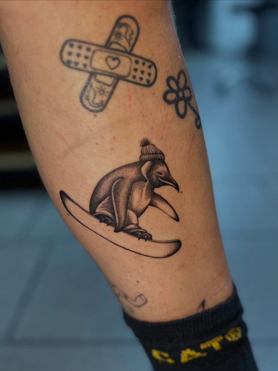 Whimsical penguin snowboard tattoo design Tattoo Design