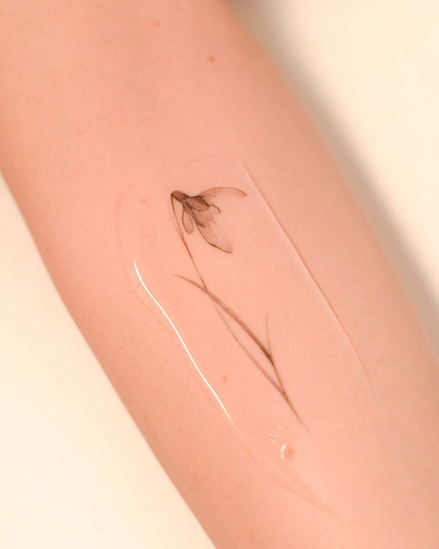 Delicate snowdrop flower tattoo on forearm Tattoo Design