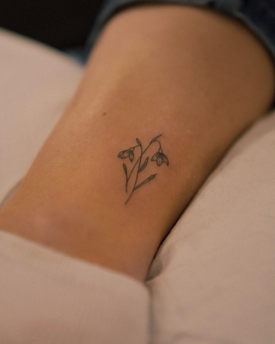 Delicate snowdrop tattoo on elegant skin Tattoo Design