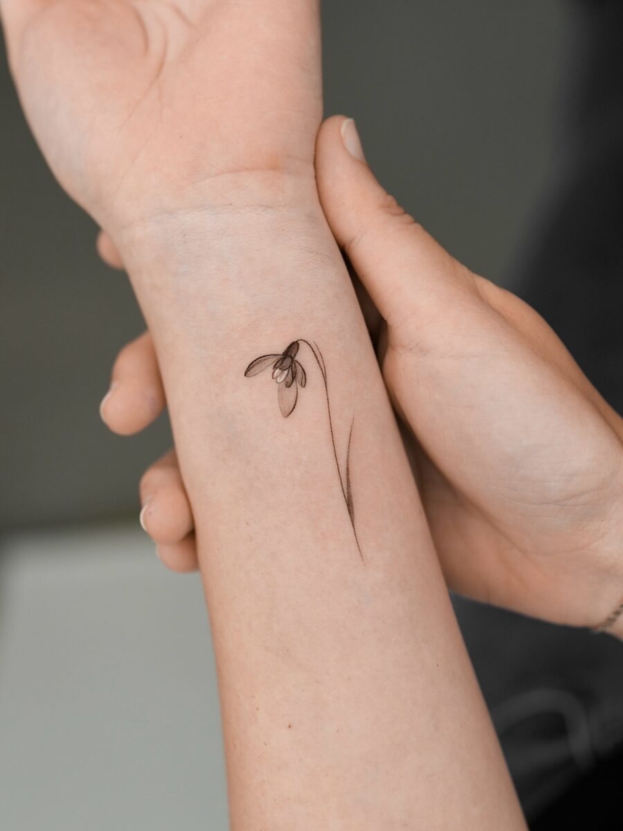 Delicate snowdrop tattoo on the forearm Tattoo Design
