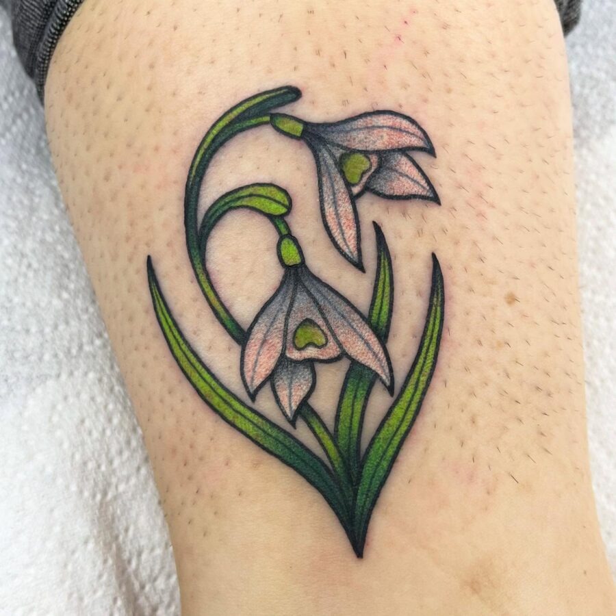 Delicate snowdrop tattoo with floral elegance Tattoo Design