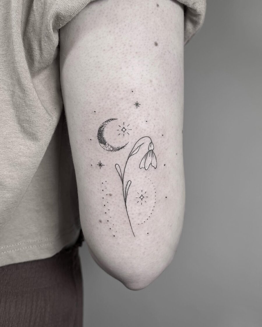 Delicate snowdrop with celestial elements Tattoo Design