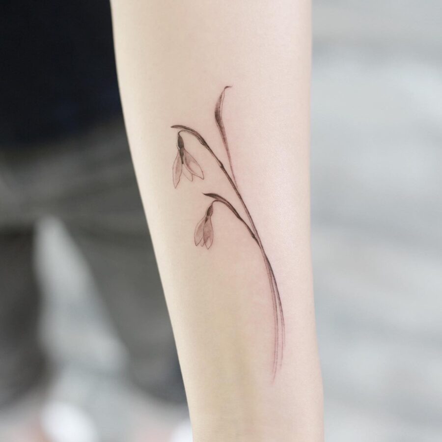 Elegant minimalist snowdrop flower tattoo design Tattoo Design