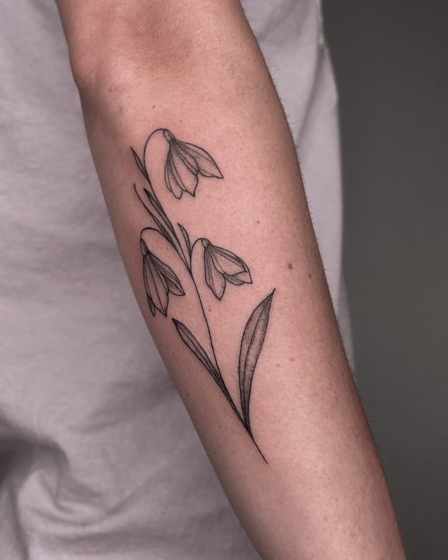 Elegant snowdrop flower tattoo on forearm Tattoo Design