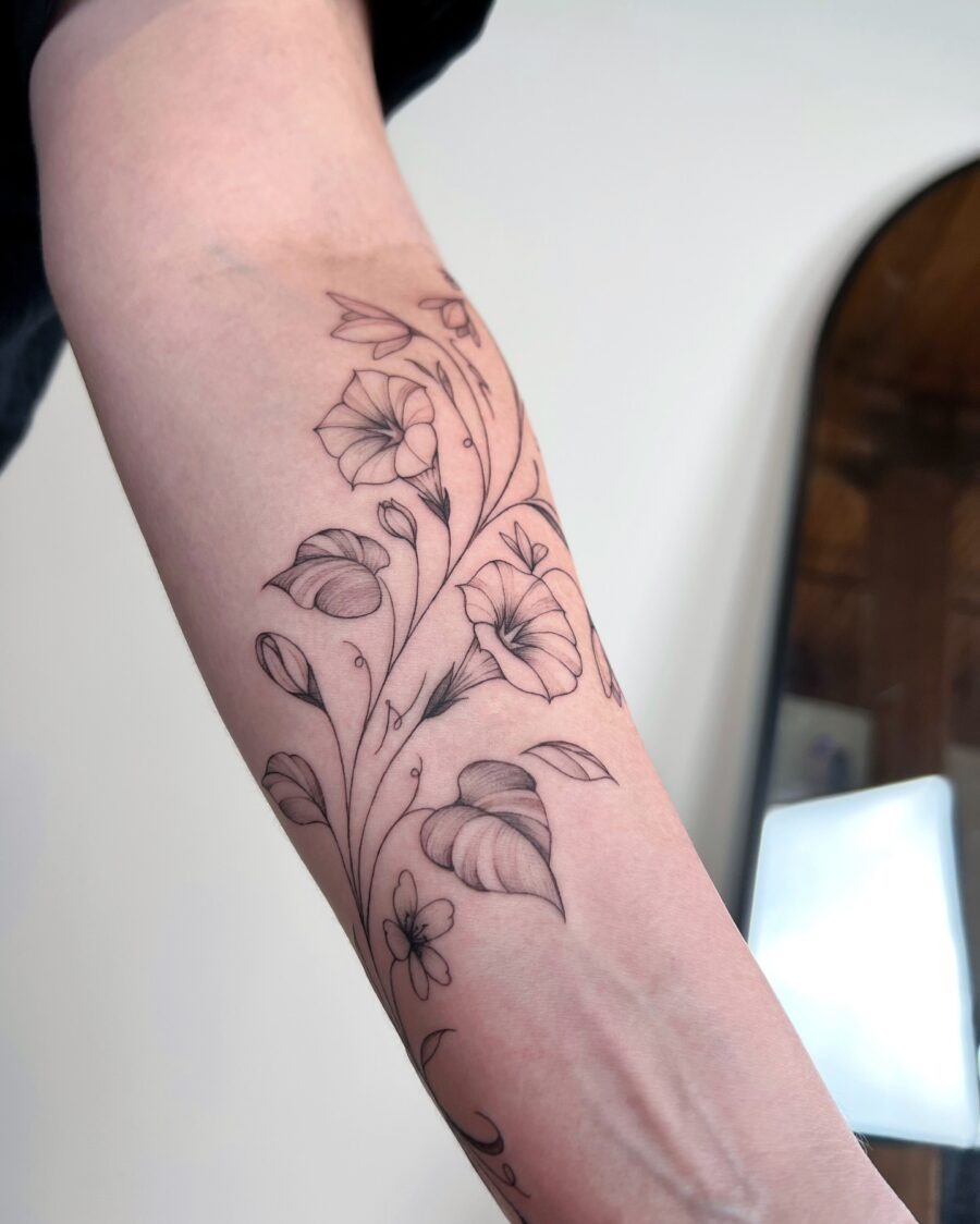 Elegant snowdrop tattoo design on forearm Tattoo Design