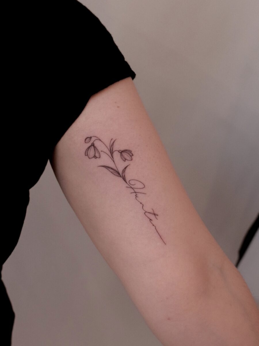 Elegant snowdrop tattoo embracing natural beauty Tattoo Design