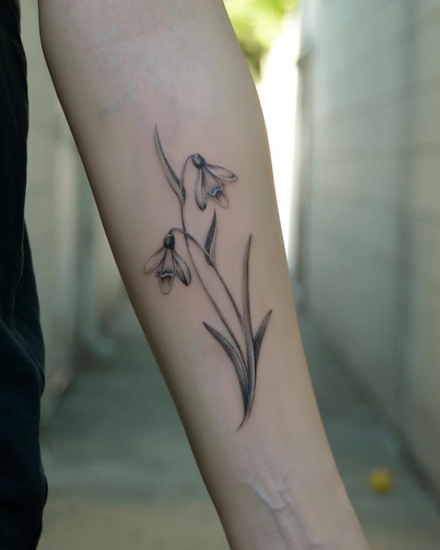 Elegant snowdrop tattoo inked in fine detail Tattoo Design