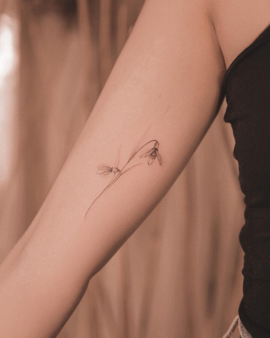 Elegant snowdrop tattoo inspiring subtle beauty Tattoo Design