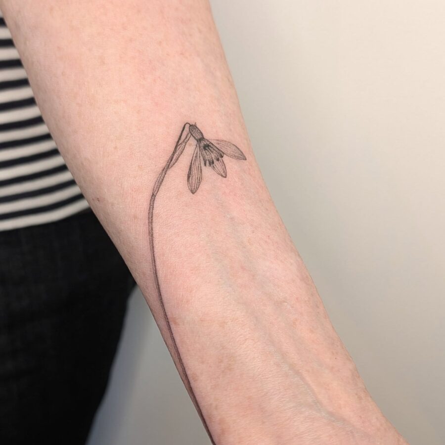 Elegant snowdrop tattoo on a delicate arm Tattoo Design