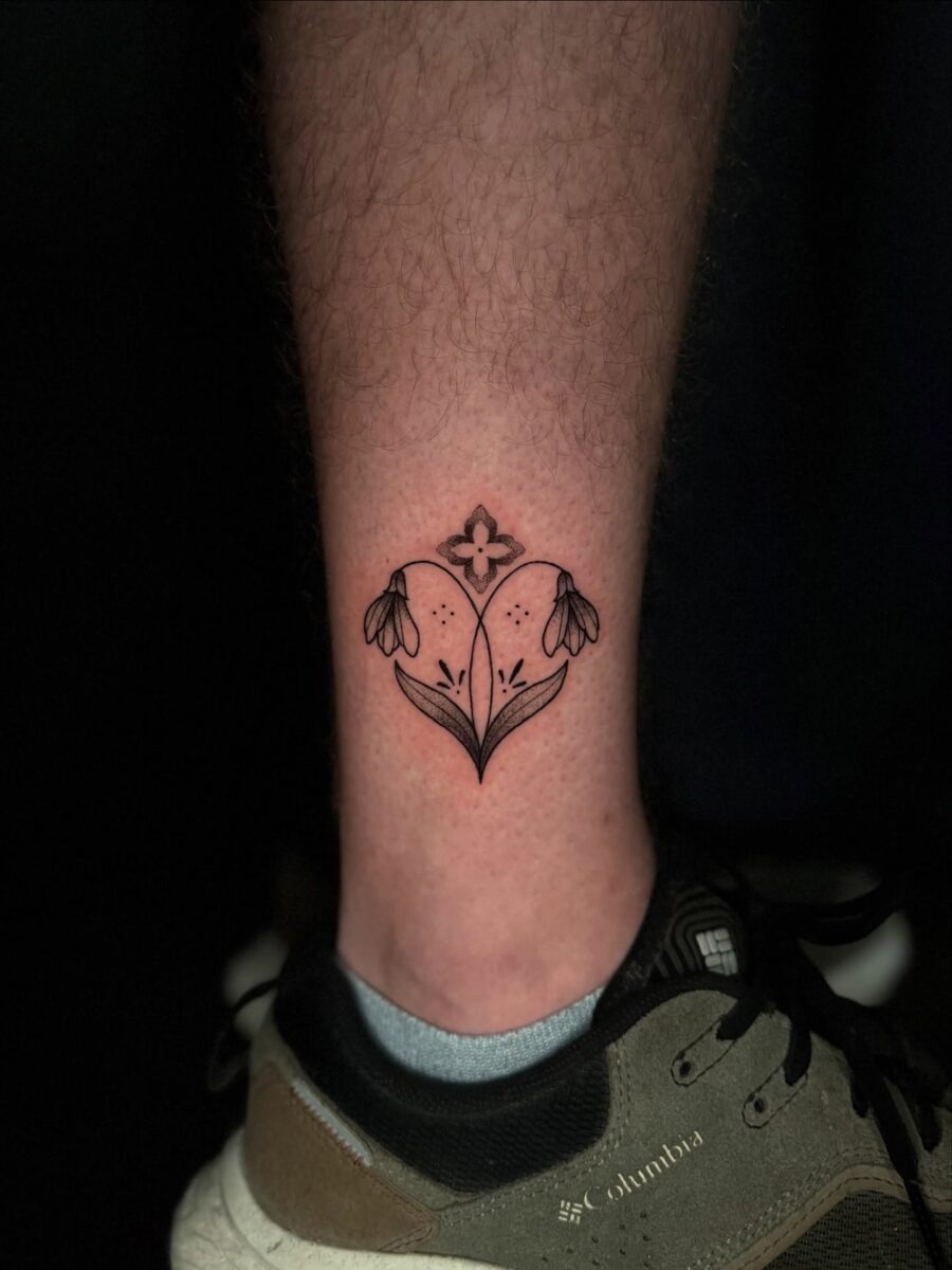 Elegant snowdrop tattoo on a leg Tattoo Design