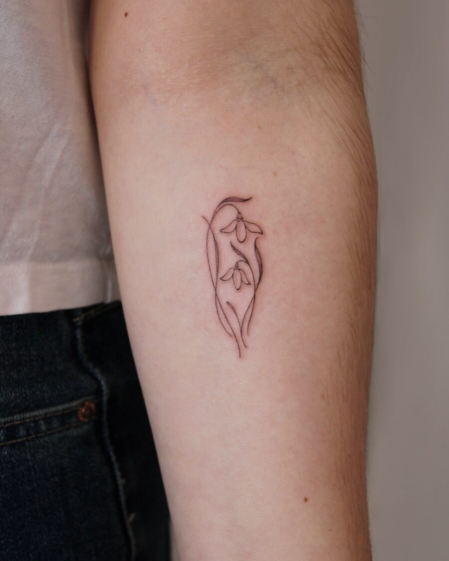 Elegant snowdrop tattoo showcasing delicate beauty Tattoo Design