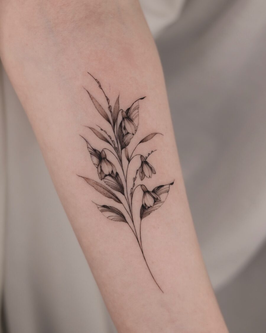 Elegant snowdrop tattoo showcasing delicate floral details Tattoo Design