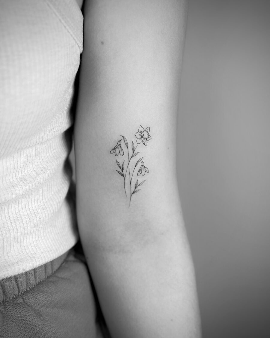 Elegant snowdrop tattoo showcasing minimalist beauty Tattoo Design