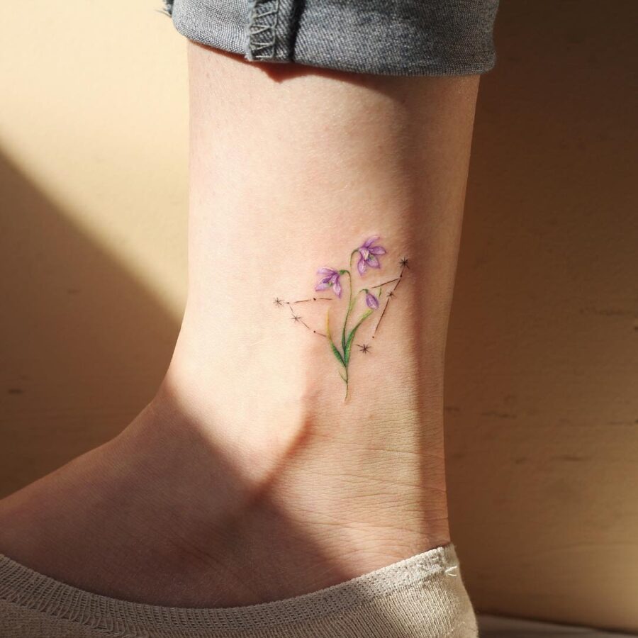 Elegant snowdrop tattoo with starry accents Tattoo Design