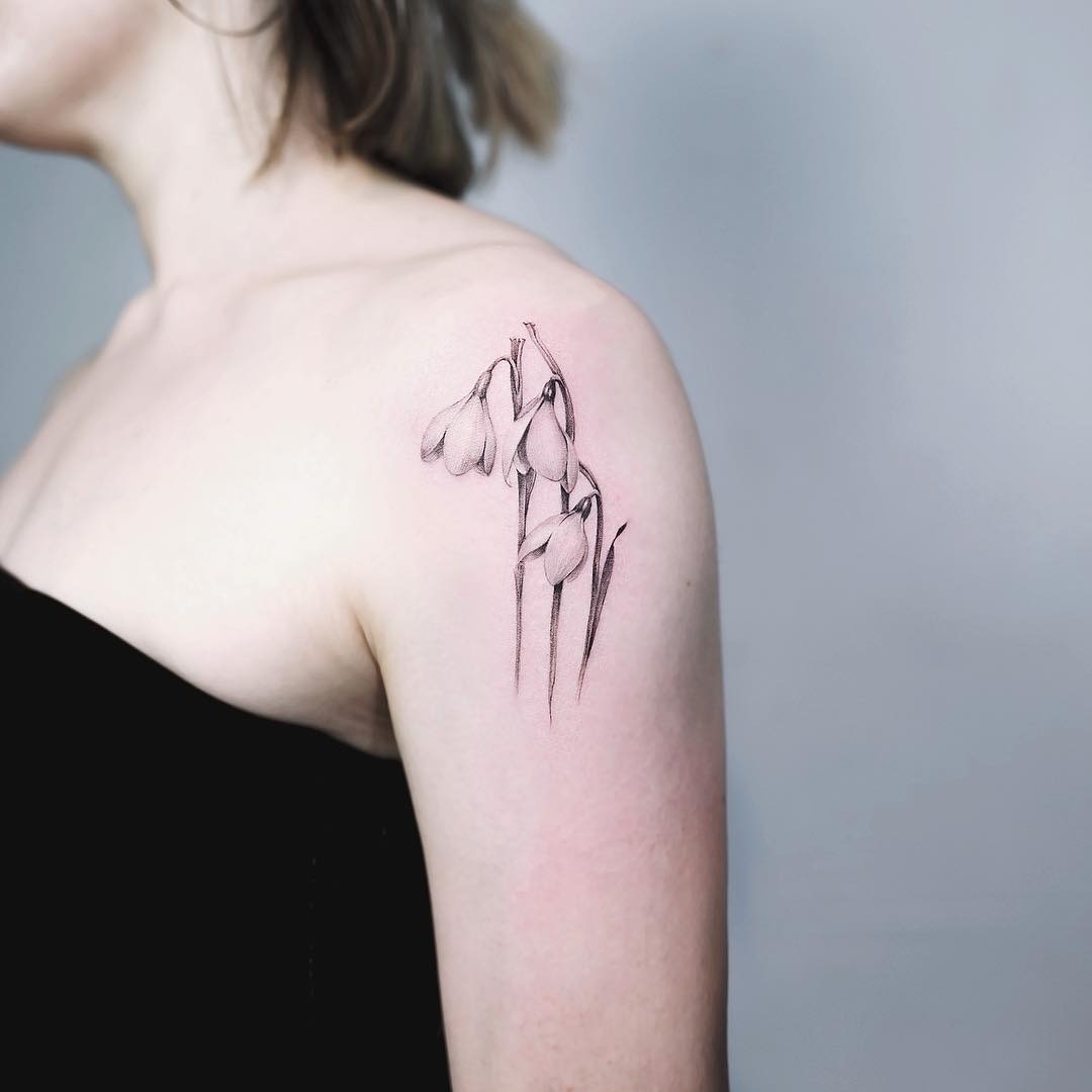 Intricate snowdrop flower tattoo on the shoulder Tattoo Design