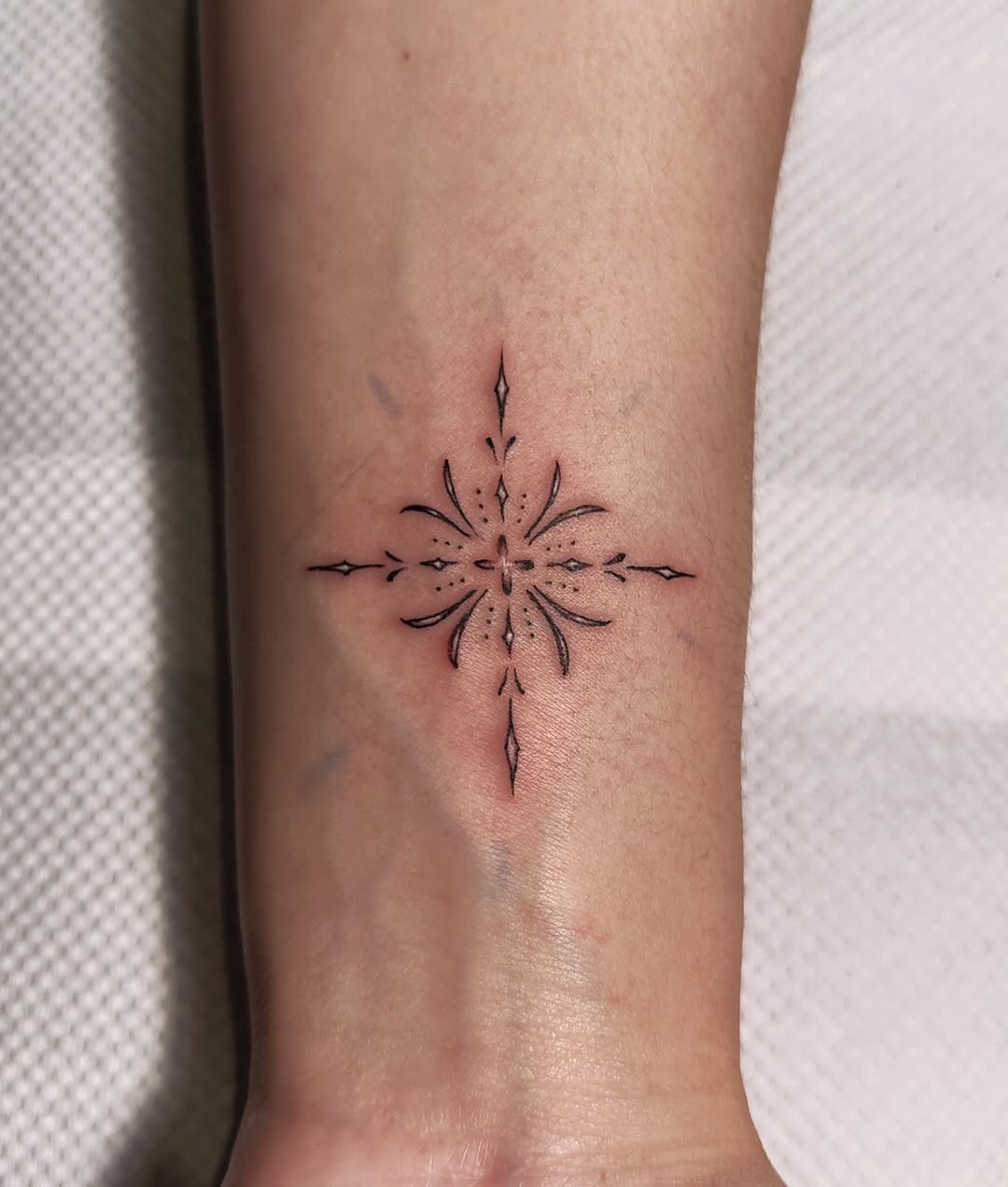Beautifully crafted minimalistic snowflake tattoo Tattoo Design