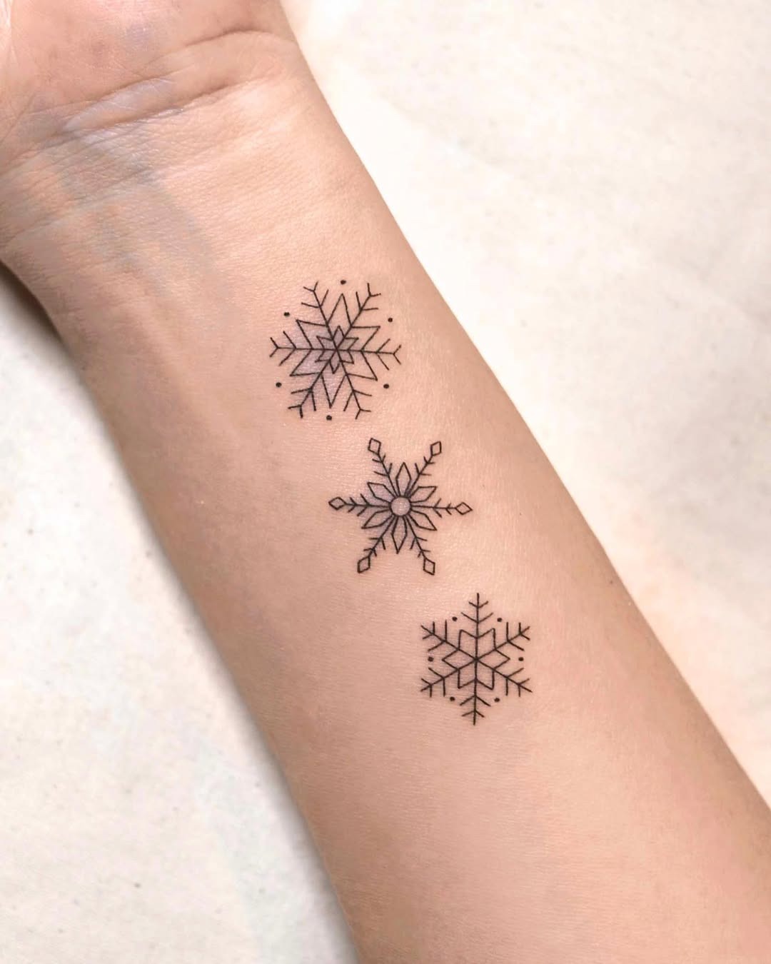 Charming minimalist snowflake tattoo designs Tattoo Design