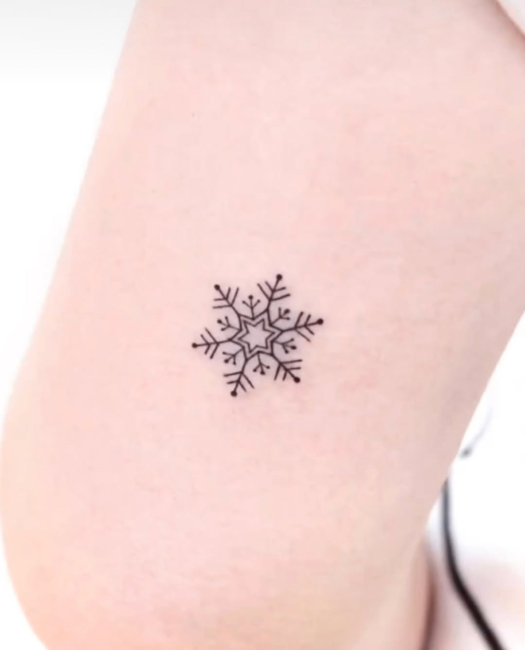 Charming minimalistic snowflake tattoo design Tattoo Design