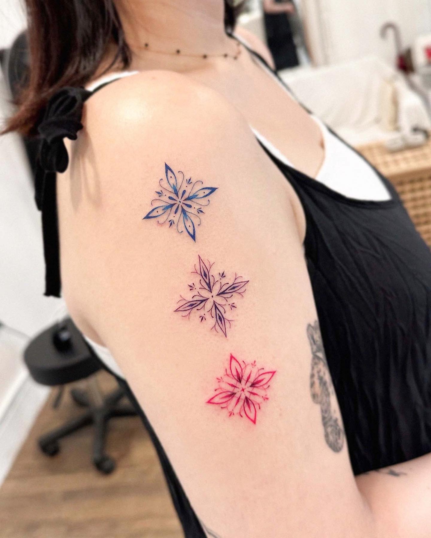 Colorful snowflake tattoos with artistic flair Tattoo Design