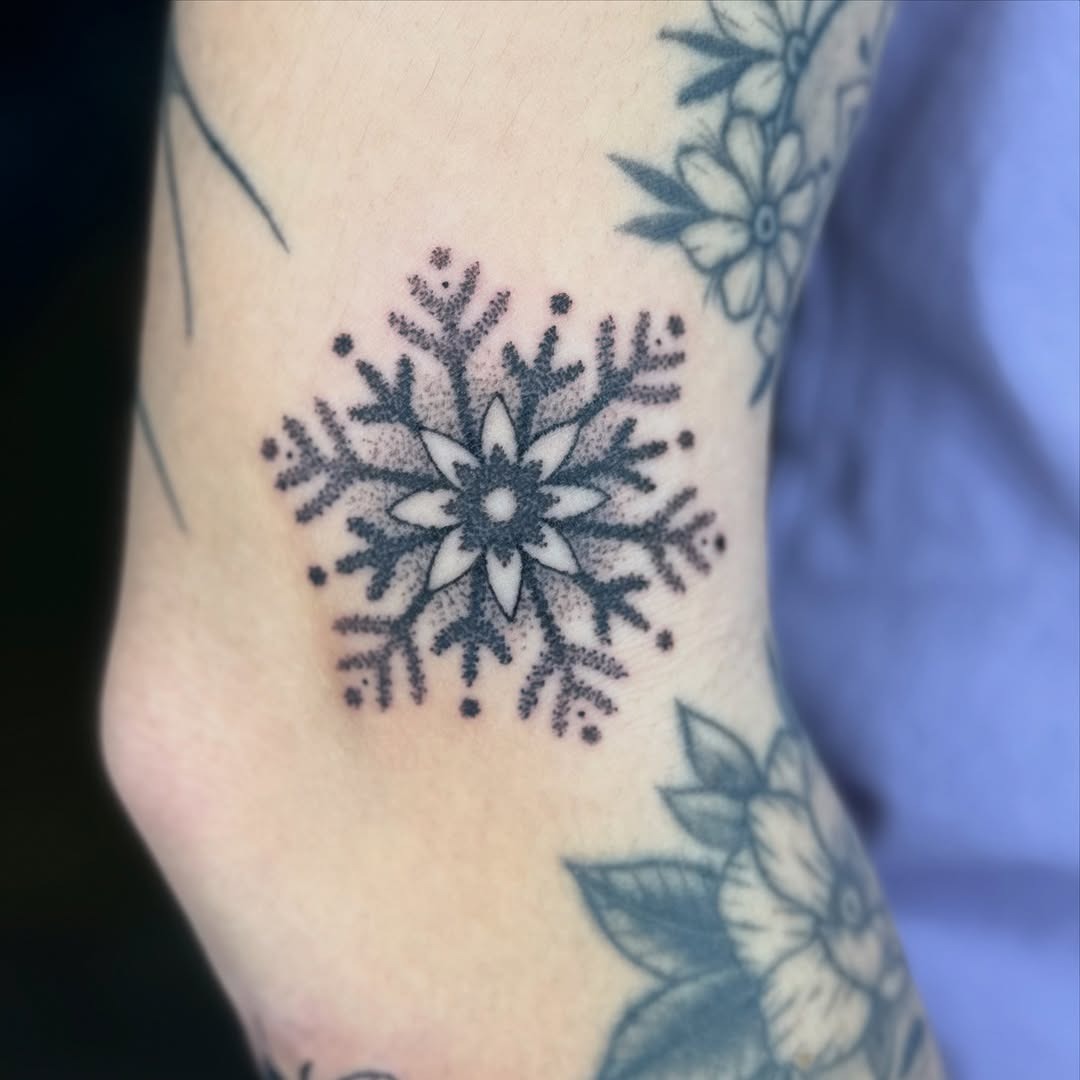 Delicate snowflake tattoo with floral touches Tattoo Design
