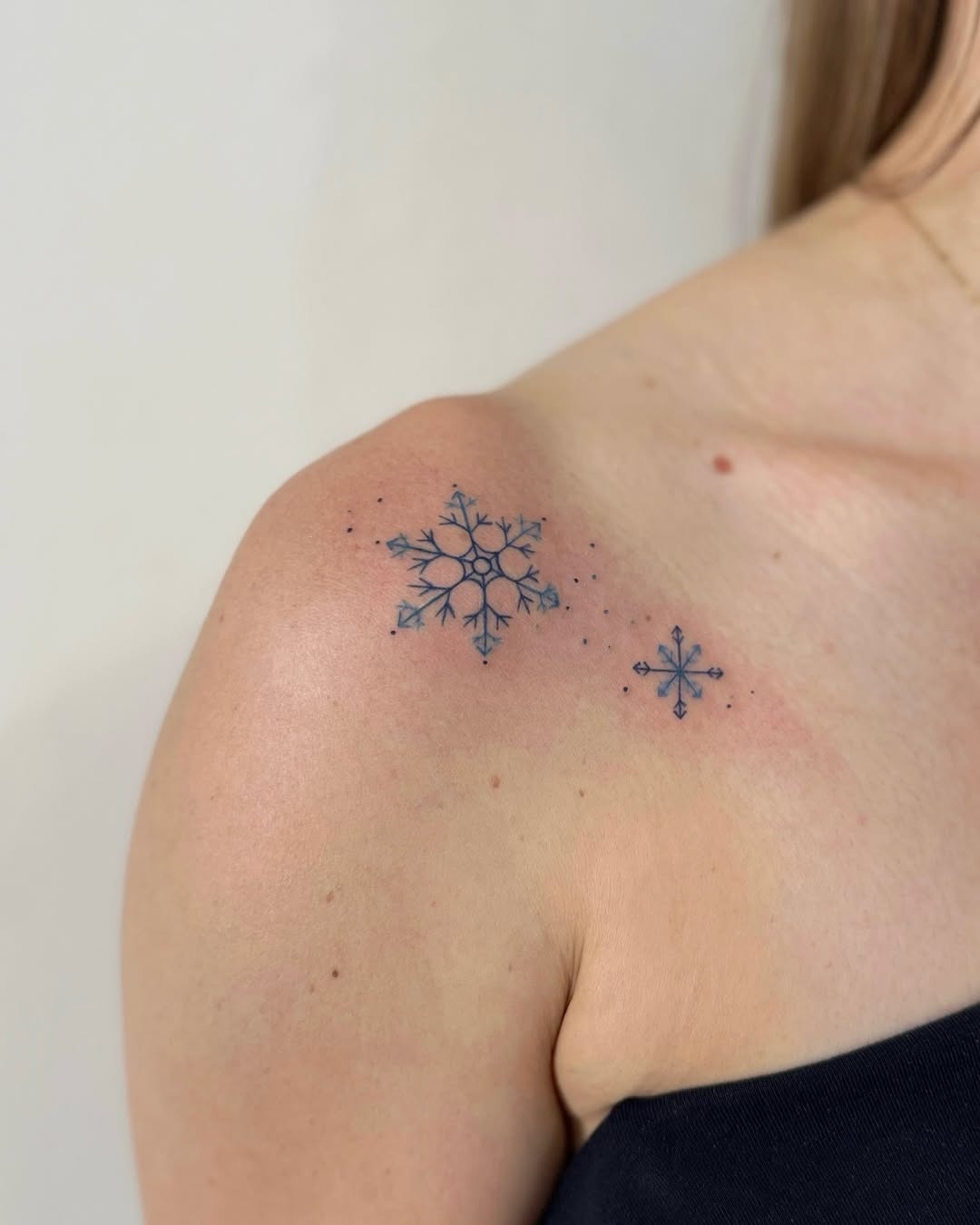 Delicate snowflake tattoos adorned on shoulder Tattoo Design