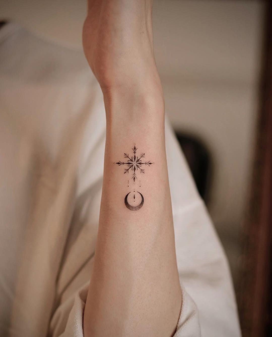Elegant snowflake design with crescent moon Tattoo Design