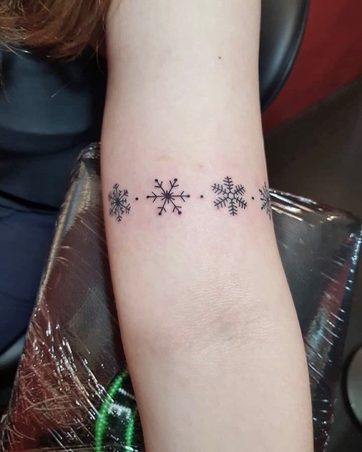 Elegant snowflake tattoo designs in fine lines Tattoo Design