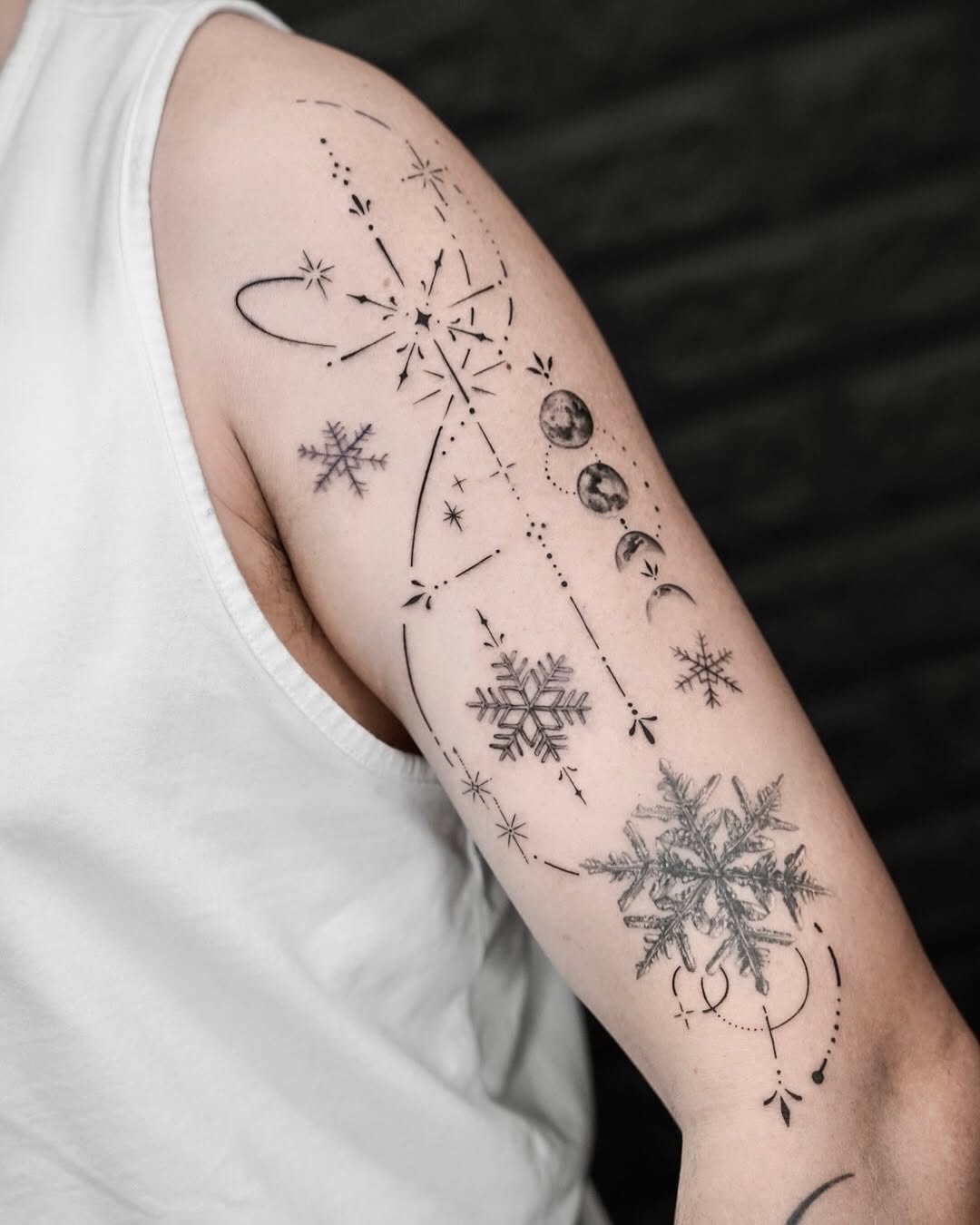 Elegant snowflake tattoo with celestial elements Tattoo Design