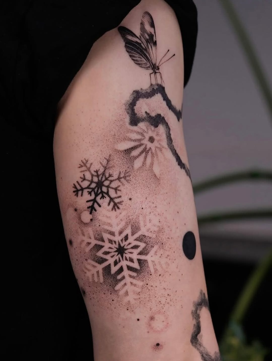 Elegant snowflake tattoo with delicate details Tattoo Design