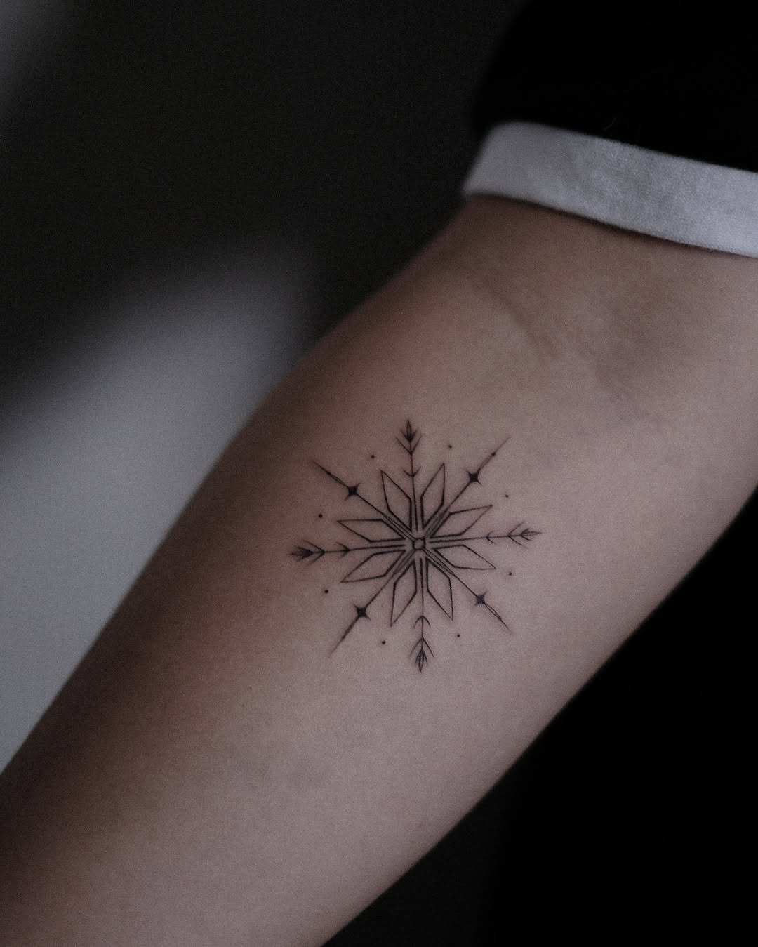 Elegantly crafted black snowflake tattoo design Tattoo Design