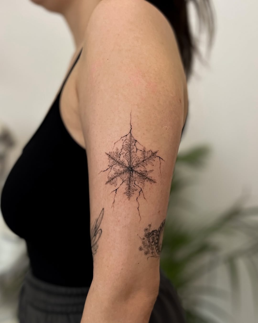 Intricate snowflake tattoo showcasing natural beauty Tattoo Design