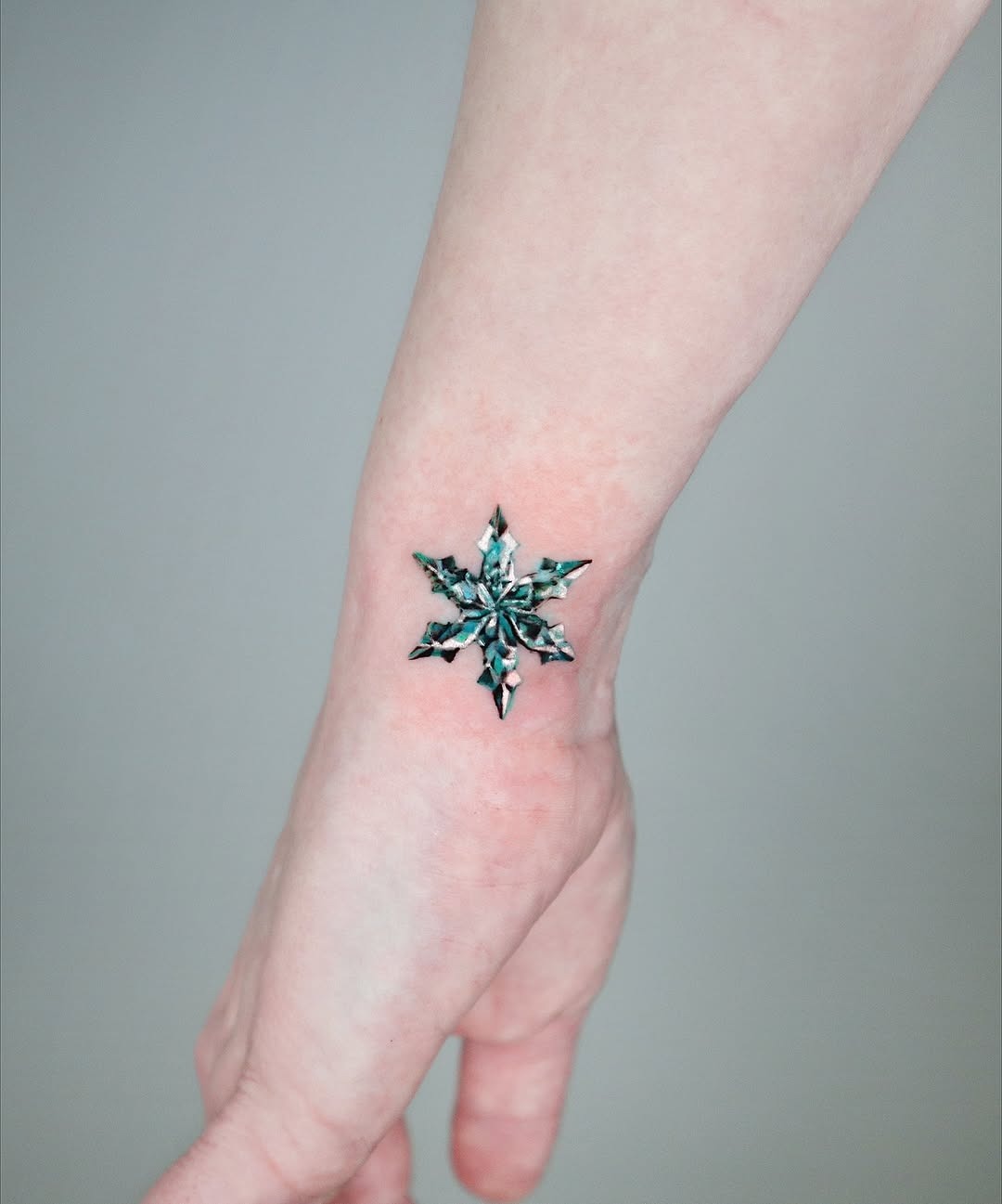 Stunning geometric snowflake tattoo design Tattoo Design