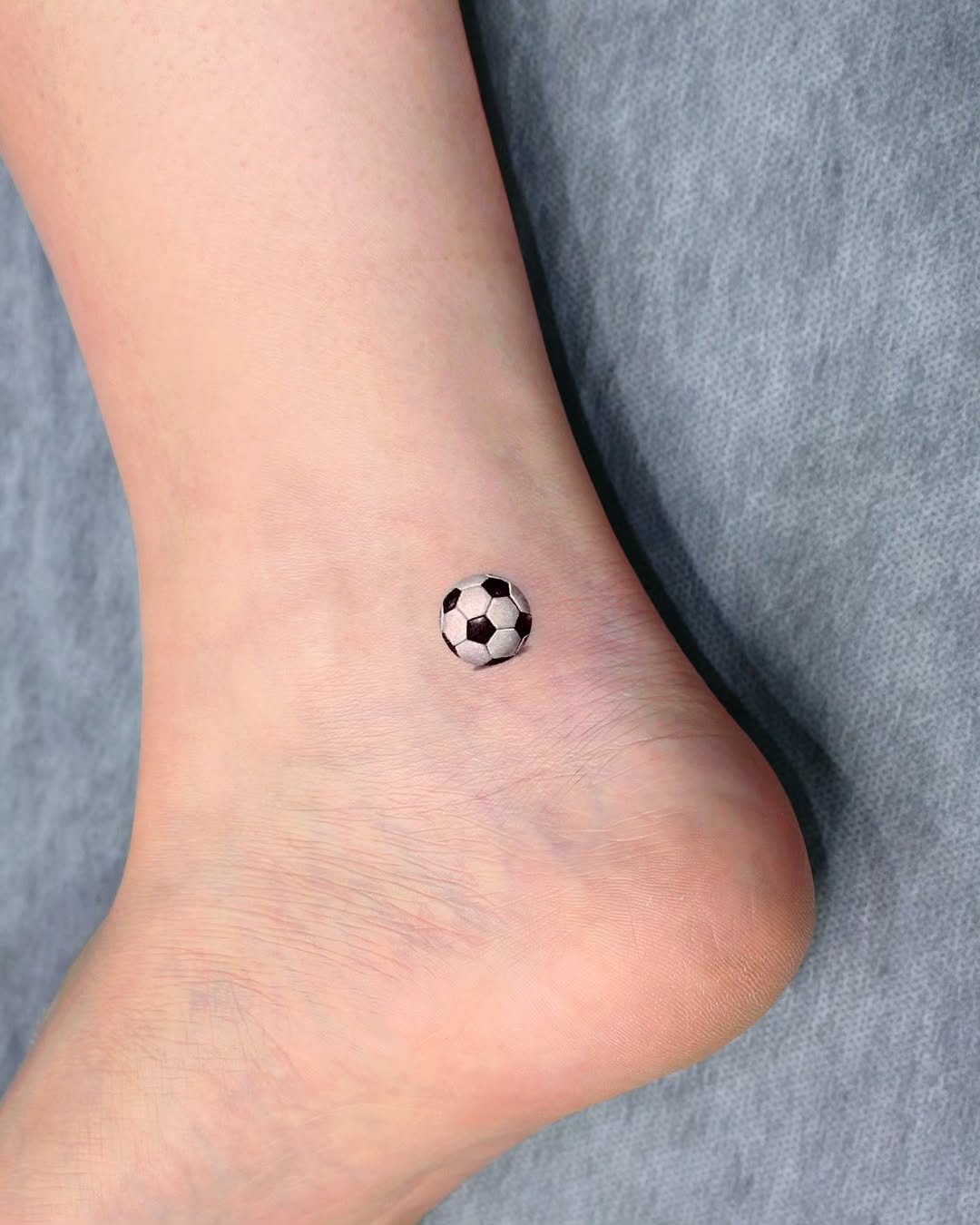 Stylish soccer tattoo on the ankle Tattoo Design
