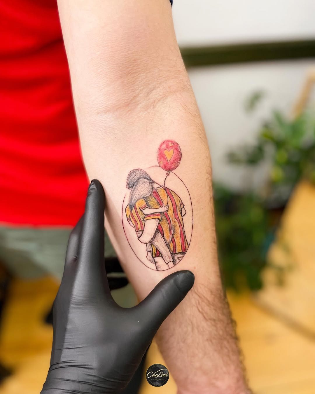 Vibrant tattoo of a soccer player with balloon Tattoo Design