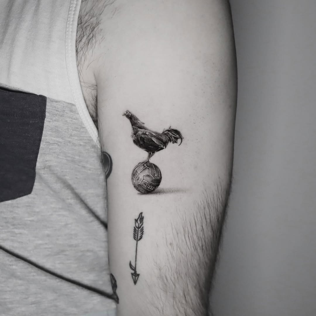 Whimsical chicken balancing on a soccer ball tattoo Tattoo Design