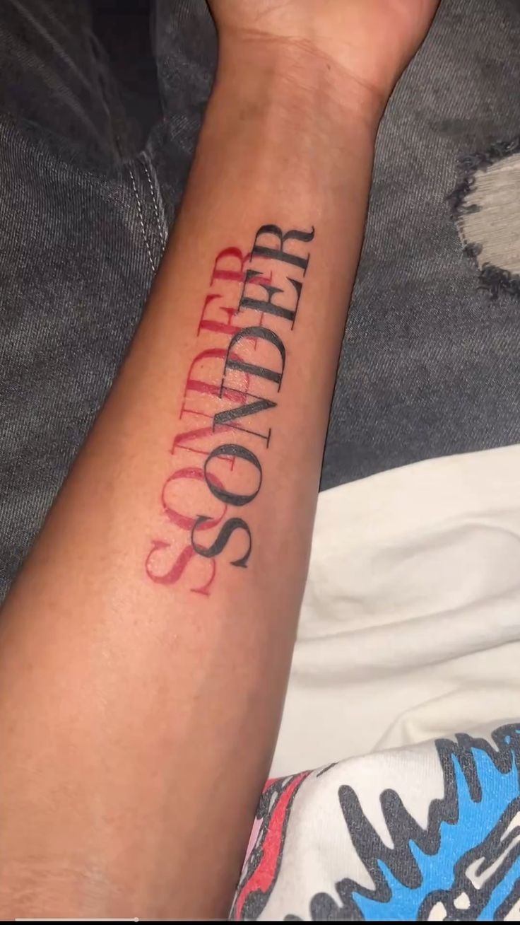Bold Red and Black Sonder Script Tattoo Design