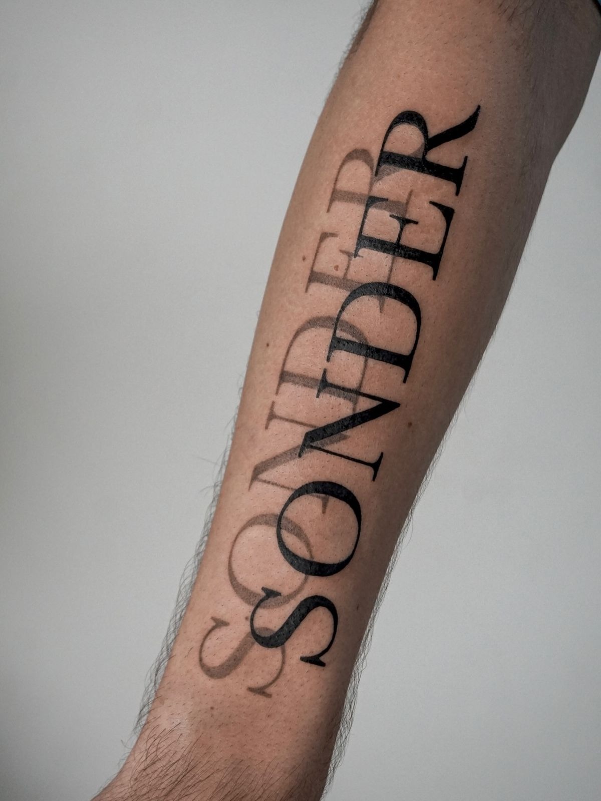Classic Black Sonder Inner Arm Tattoo Design