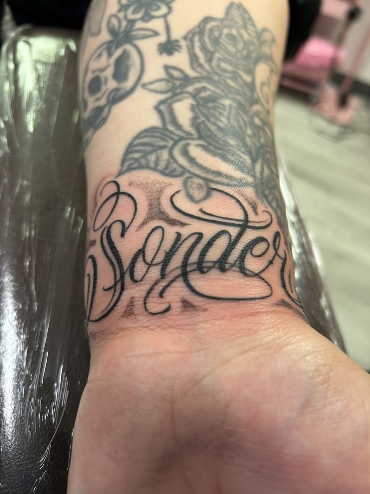 Flowing Cursive Sonder Wrist Tattoo Tattoo Design